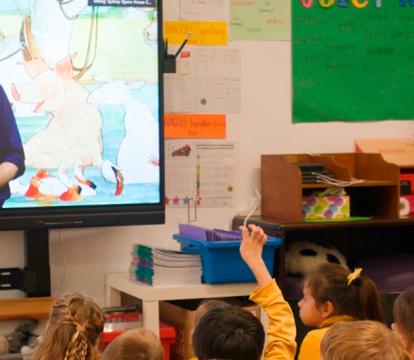 Kids learning in a digital classroom.