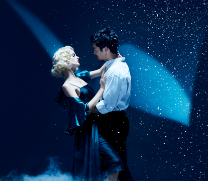 A couple is dancing on the stage.