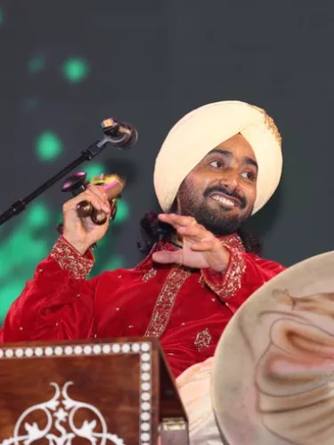 A man in a turban holds a microphone