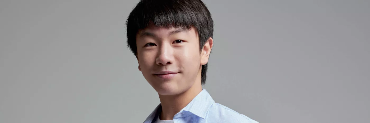 Australian violinist Christian Li in a blue collared shirt