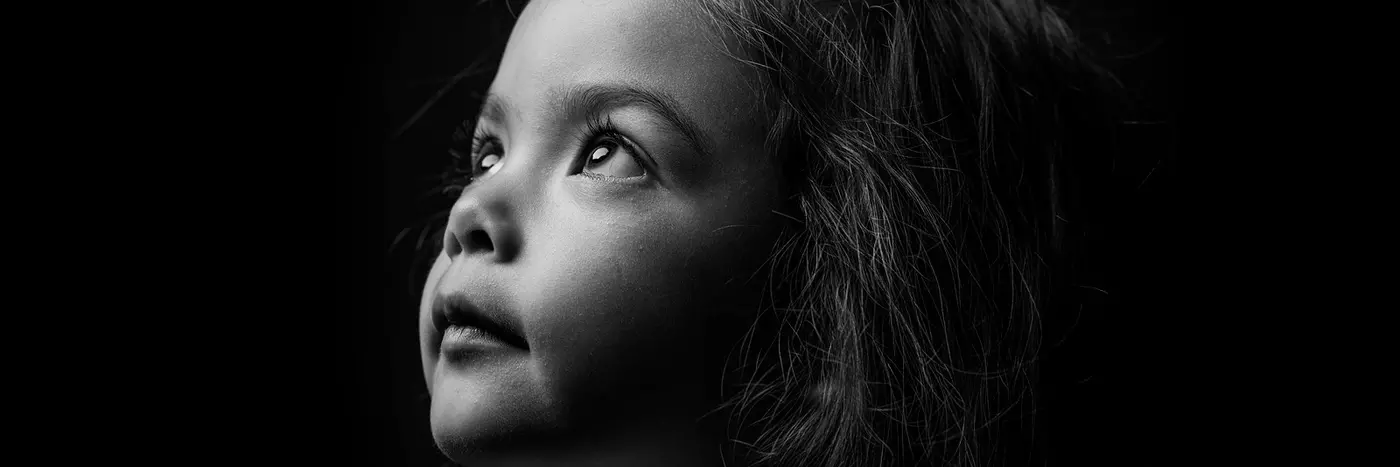 A girl looking at the sky.