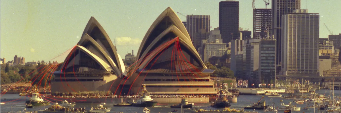 The grand opening of the Sydney opera house with boats around the harbor.