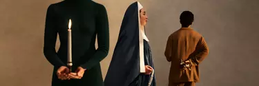 A woman dressed as a nun faces the right. Another woman wearing black holds a candle and a man faces the back wearing a copper coloured suit.