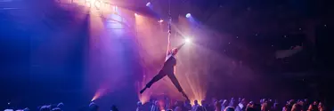 A man doing an aerial performance.