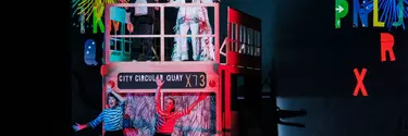 People dancing on a tour bus