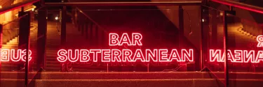 Close up of red LED 'Bar Subterranean' sign