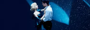 A couple is dancing on the stage.