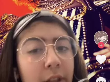 A TikTok screen shot with a girl in glasses.